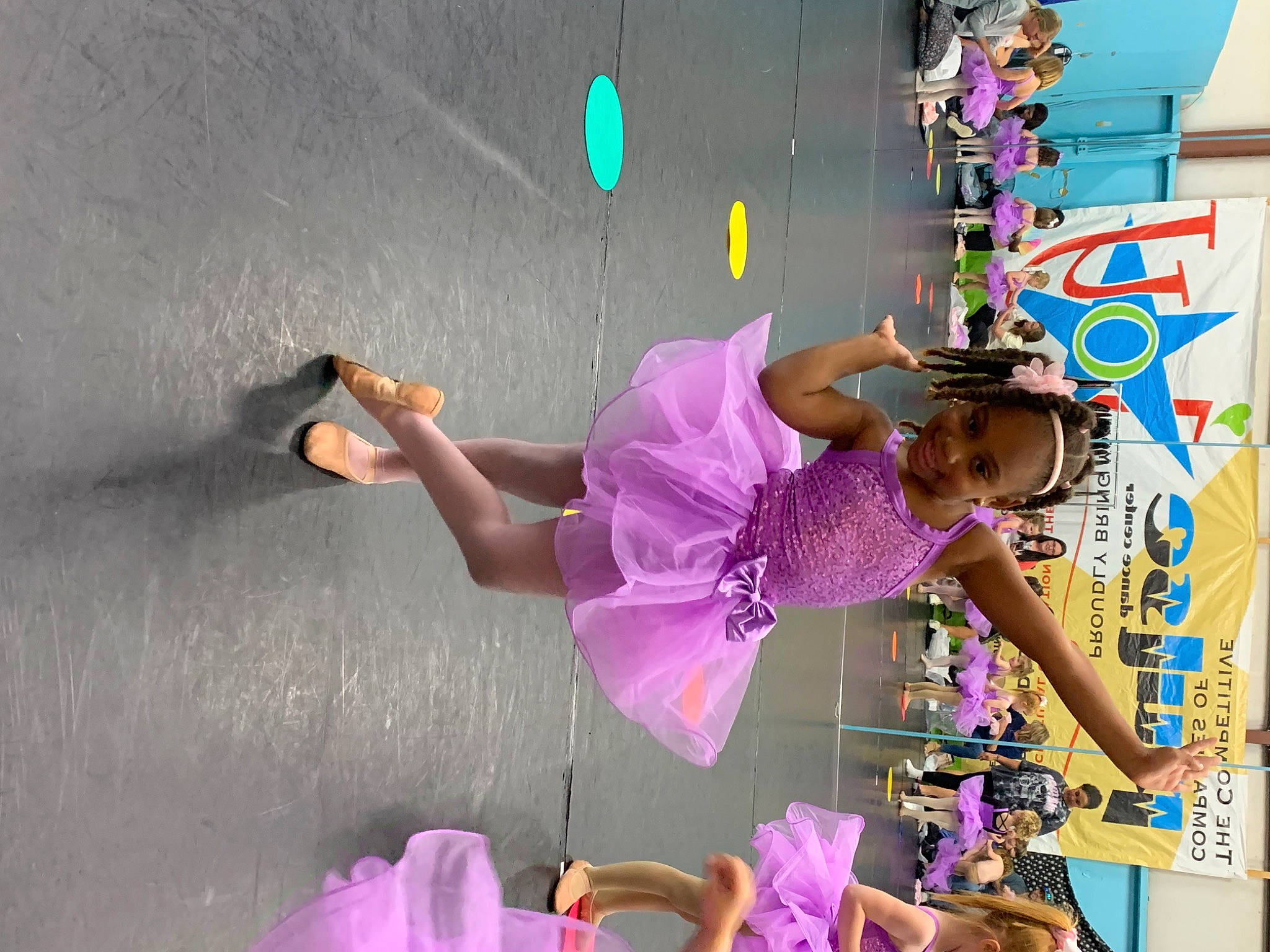 Amaya is registered to the contest to win money with this photo: child, entertainment, event, fashion, fun, joy, leisure, magenta, performing_arts, person, pink, plant, play, purple, recreation, room, tire, toddler, toy, tree