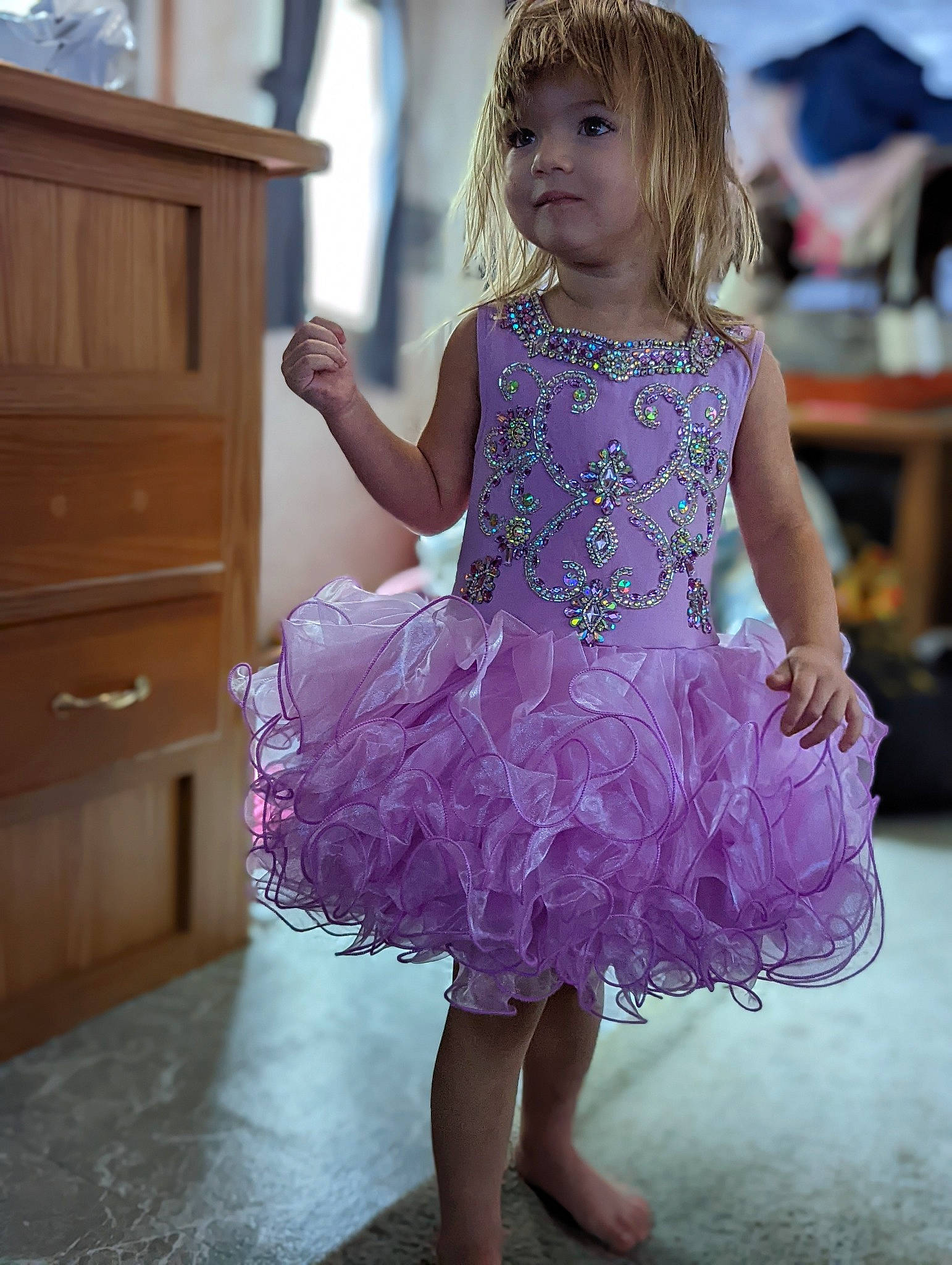 Shelby Mace is registered to the contest to win money with this photo: baby_toddler_clothing, blond, cabinetry, child, day_dress, drawer, dress, dresser, embellishment, event, fun, happy, magenta, one_piece_garment, person, pink, purple, shoulder, smile, toddler