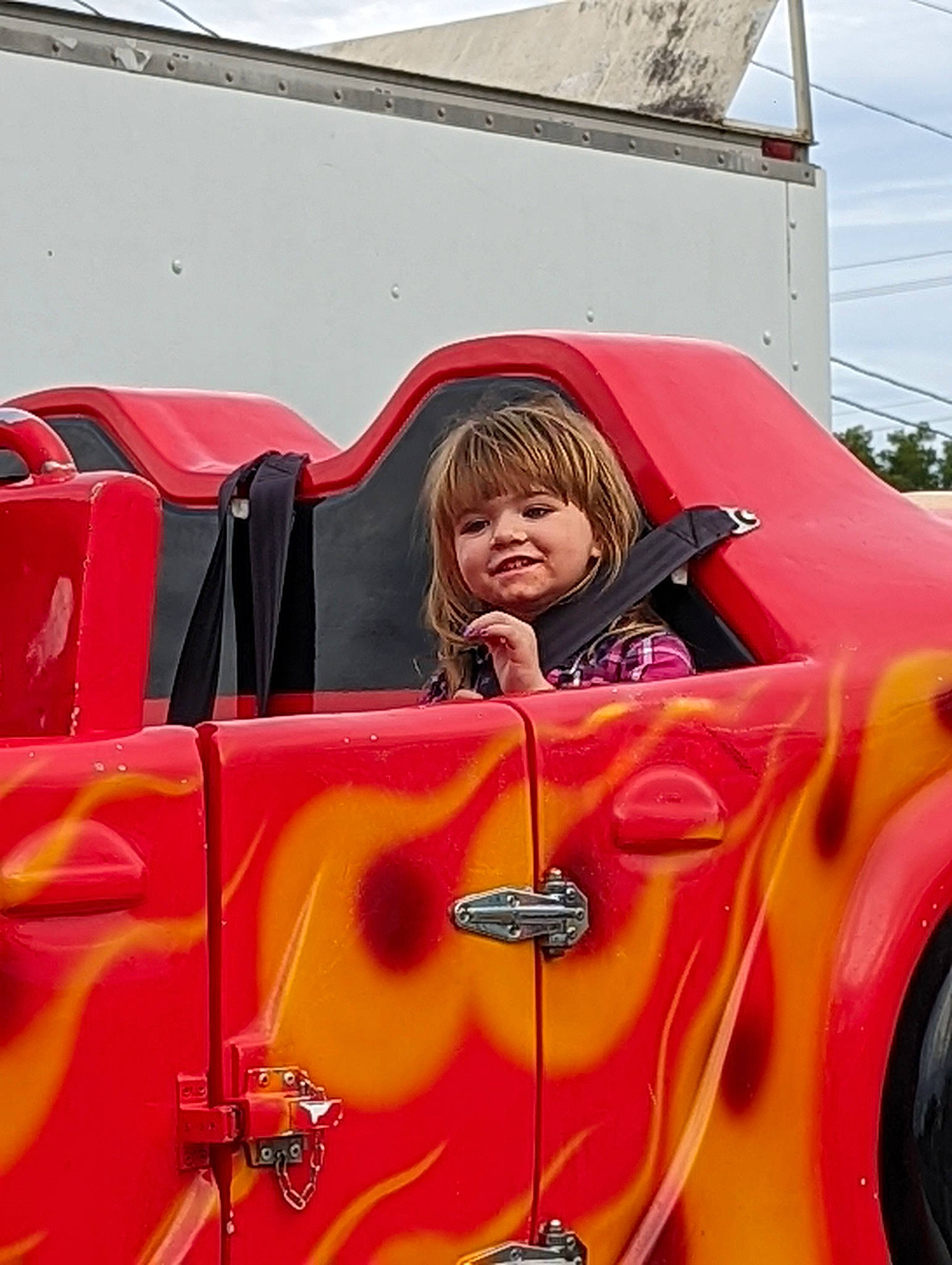 Shelby Mace is registered to the contest to win money with this photo: automotive_design, automotive_exterior, automotive_lighting, automotive_tire, automotive_wheel_system, bumper, car, classic, classic_car, fender, helmet, hood, jacket, joy, motor_vehicle, person, tire, toddler, vehicle, vehicle_door