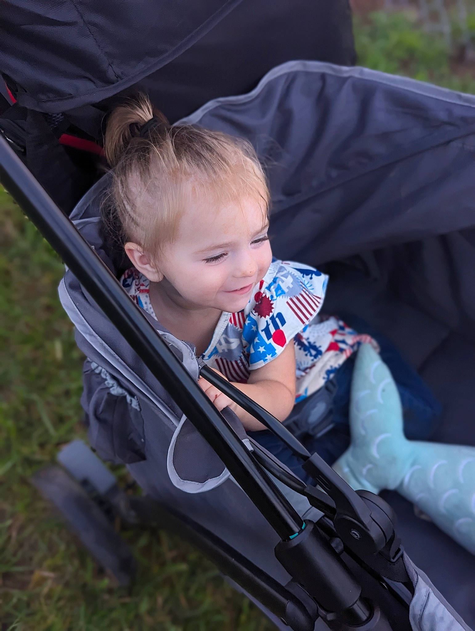 Nevaeh Faith Mace joined the competition — help win amazing prizes! baby, baby_carriage, baby_products, baby_safety, baby_toddler_clothing, child, comfort, electric_blue, fun, grass, joy, lap, person, plant, sitting, smile, toddler, tree