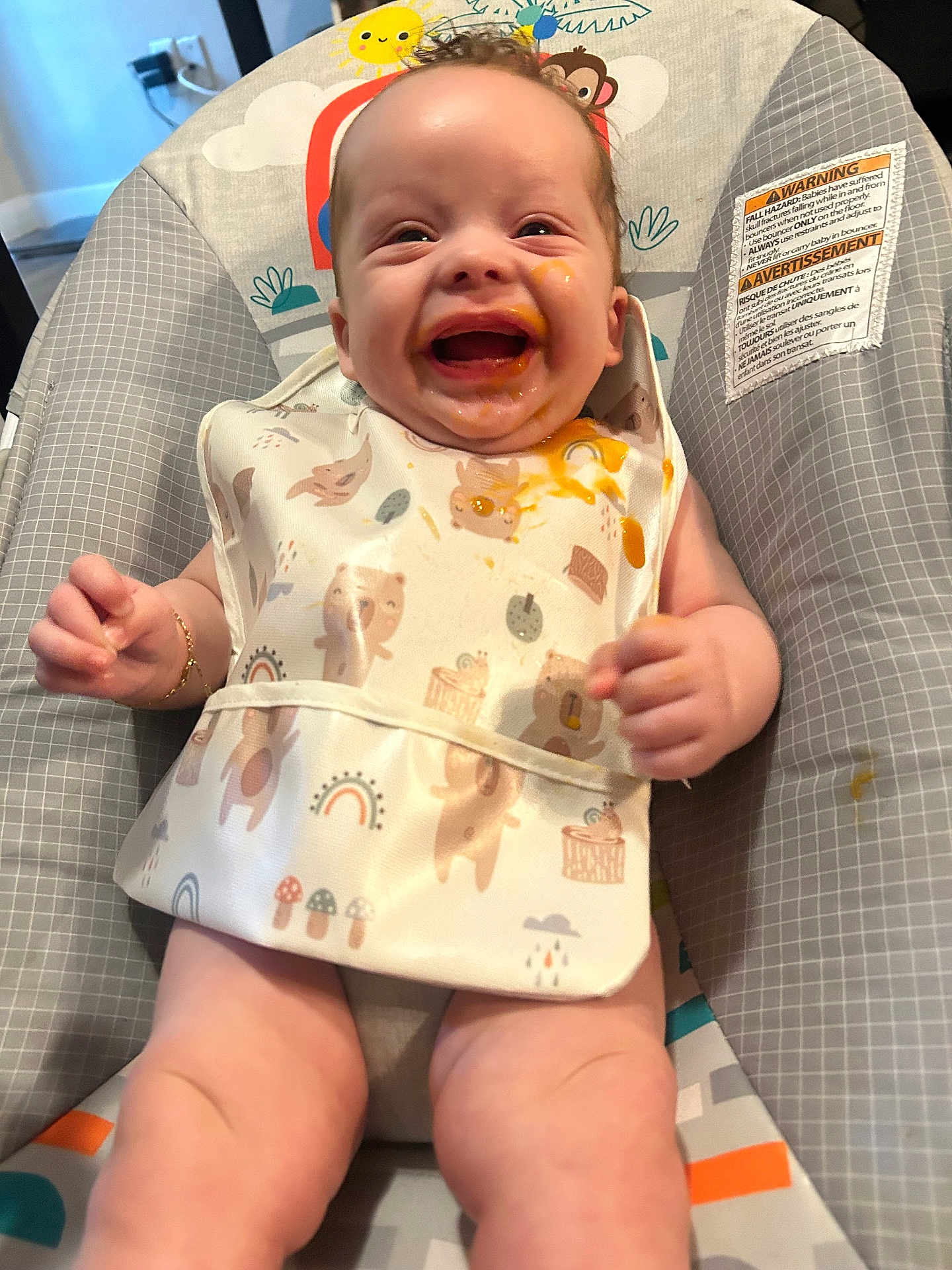 Montrell joined the competition — help win amazing prizes! baby, bib, food, messy, smiling, happy, infant, child, cute, sitting, highchair, clothing, indoors, face, skin, expression, joy, playful, colorful, comfort