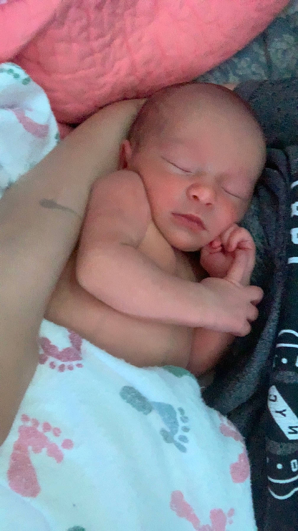 Cleo is registered to the contest to win money with this photo: abdomen, arm, baby, baby_products, baby_sleeping, baby_toddler_clothing, bedtime, chest, child, comfort, linens, nail, nap, person, pink, room, sitting, skin, textile, thumb