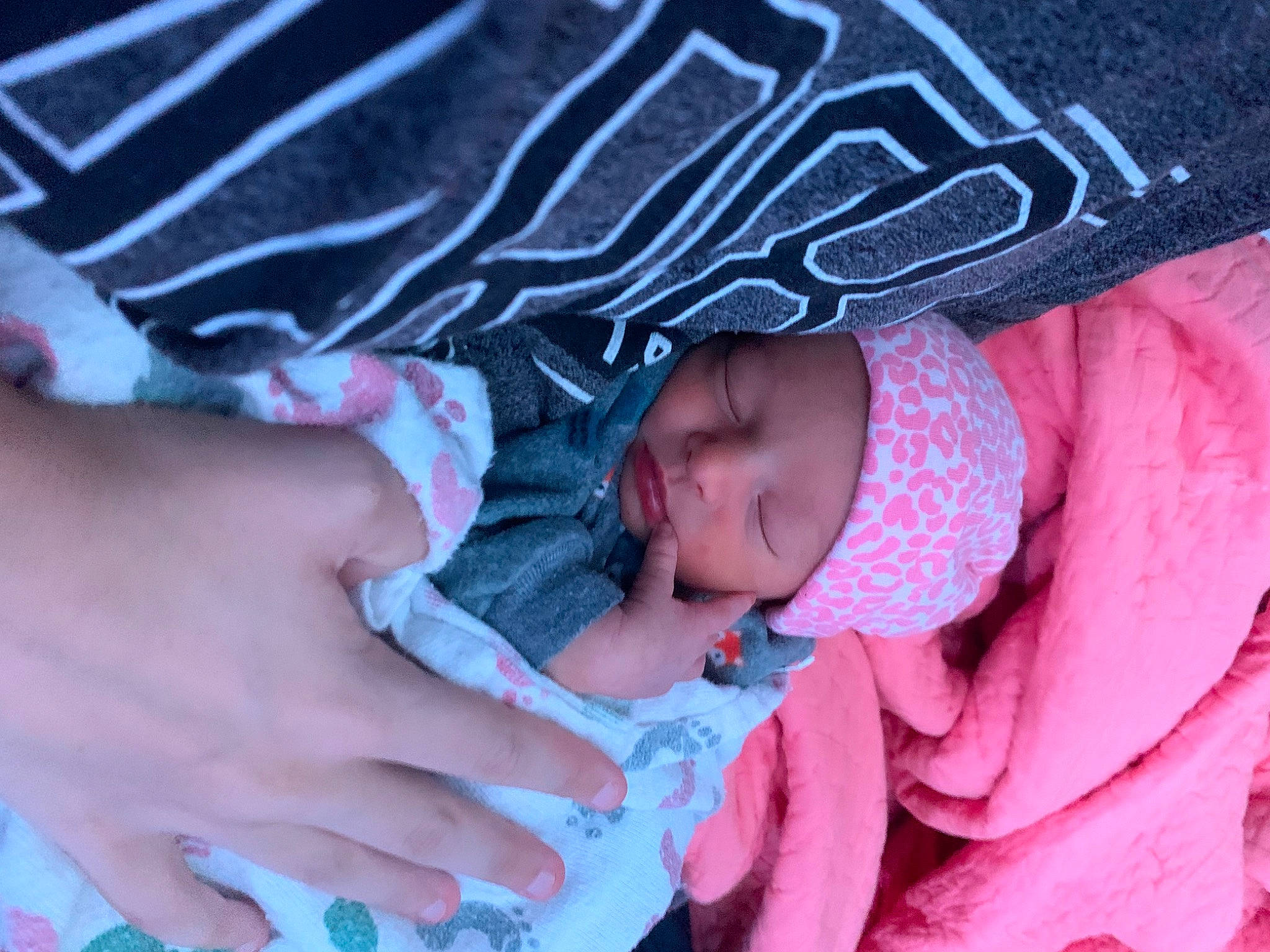 Cleo is registered to the contest to win money with this photo: baby, baby_products, baby_sleeping, baby_toddler_clothing, child, comfort, electric_blue, finger, headwear, linens, magenta, nail, pattern, person, pink, purple, sleeve, textile, thumb, toddler