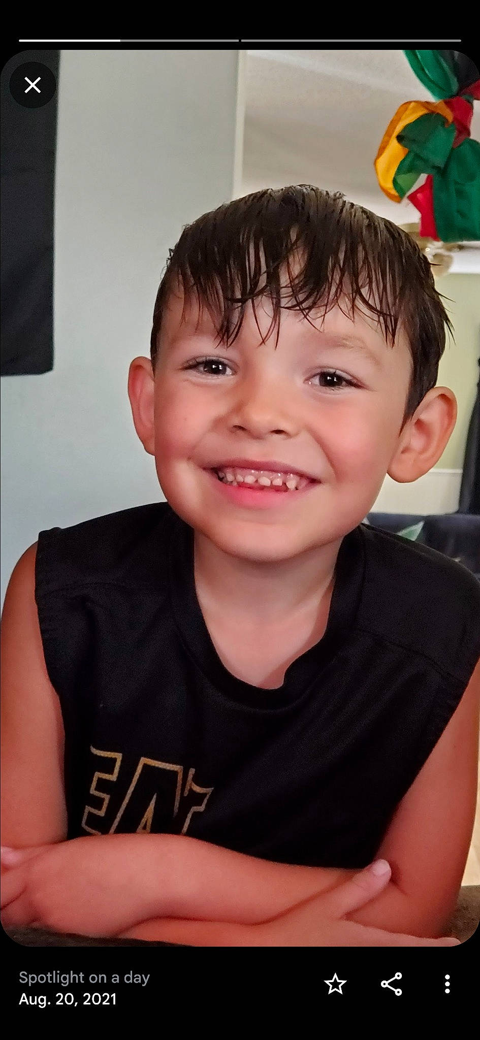 Kaylub is registered to the contest to win money with this photo: cheek, child, chin, eye, eyelash, flash_photography, forehead, fun, gesture, happy, joy, muscle, person, portrait_photography, room, sitting, skin, sleeve, smile, t_shirt