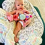 Audi-Kole joined the competition — help win amazing prizes! baby, infant, plush_toy, blanket, cushion, diaper, indoor, carpet, person, child, cute, comfort, soft_toy, patterned, home, relaxing, curious, wrapped, seated, furniture