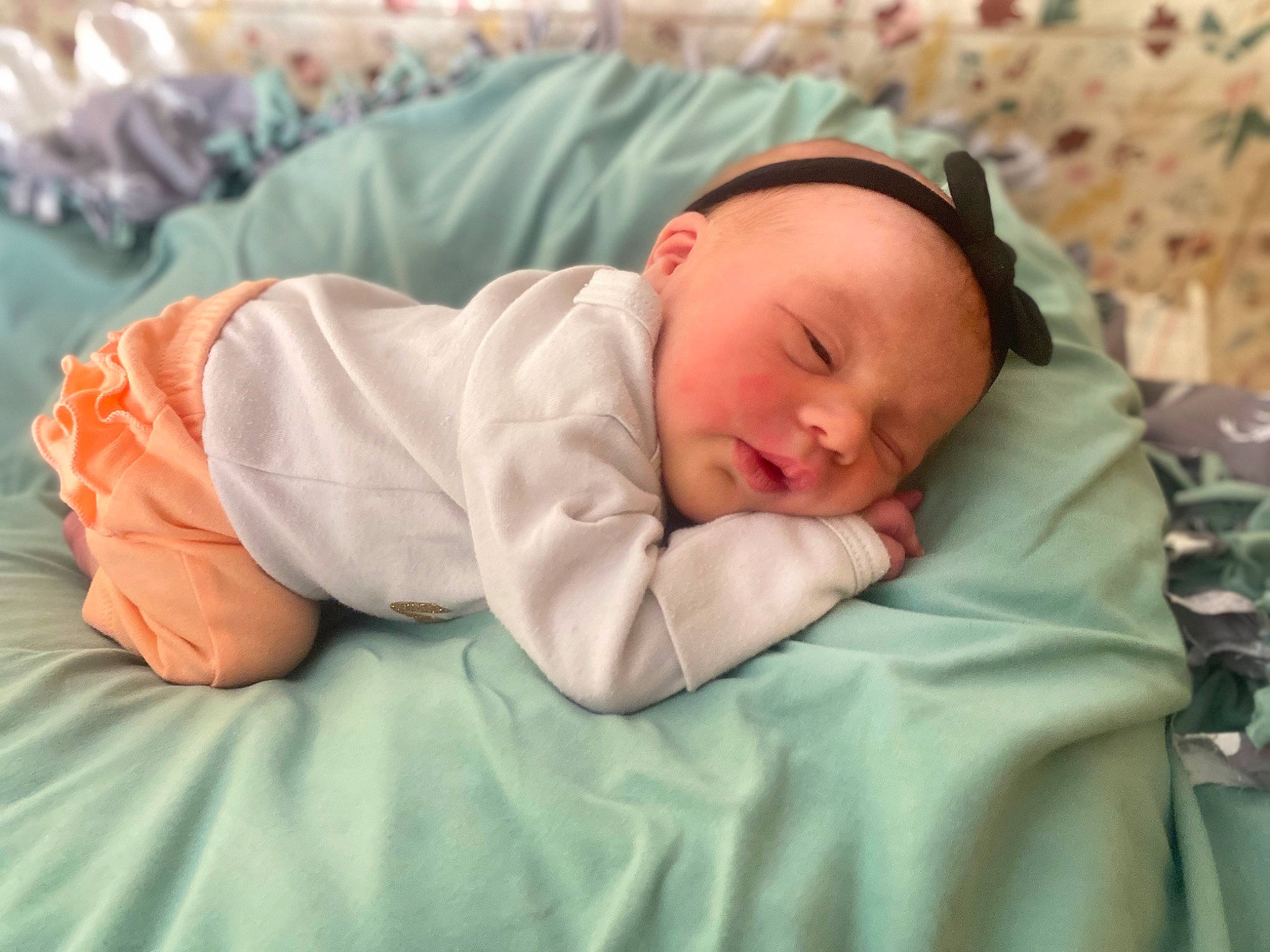 Kimber joined the competition — help win amazing prizes! baby, baby_products, baby_sleeping, baby_toddler_clothing, bedtime, cheek, child, comfort, eye, face, grass, hat, head, human_body, linens, nap, person, room, skin, sleeve