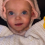 Bonnie Miamie Doyle is registered to the contest to win money with this photo: baby, child, face, blue_eyes, knitted_blanket, pink_headband, minnie_mouse, cute, portrait, soft_texture, warm_clothing, infant, close_up, expression, adorable, cozy, smiling, headwear, indoor, young