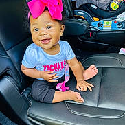Cartier is registered to the contest to win money with this photo: accessories, baby, belt, car, car_interior, carseat, clothing, cushion, face, happy, head, person, photography, portrait, sitting, sleeve, smile, t_shirt, transportation, vehicle