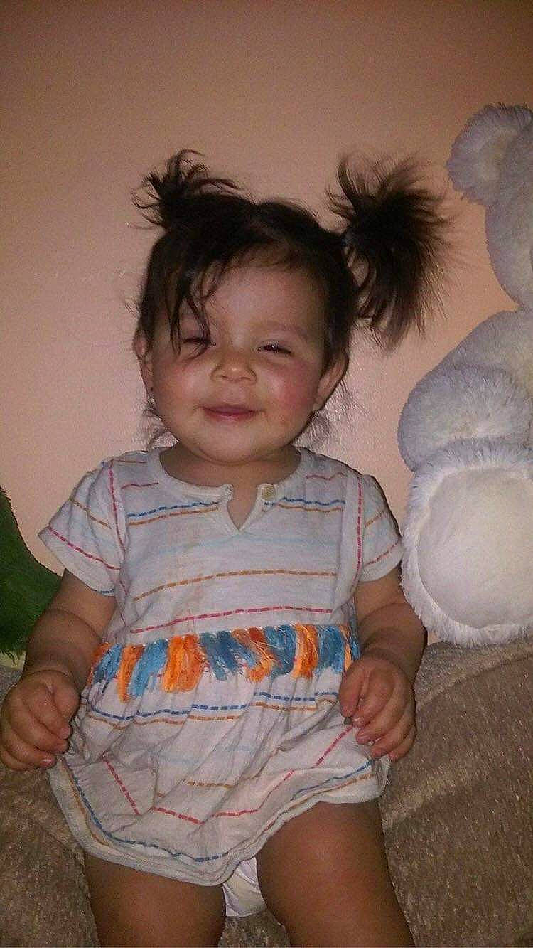 Nayla joined the competition — help win amazing prizes! baby_toddler_clothing, cheek, chin, dress, eye, facial_expression, gesture, hairstyle, happy, head, iris, joy, lip, mouth, nose, organ, person, skin, sleeve, smile