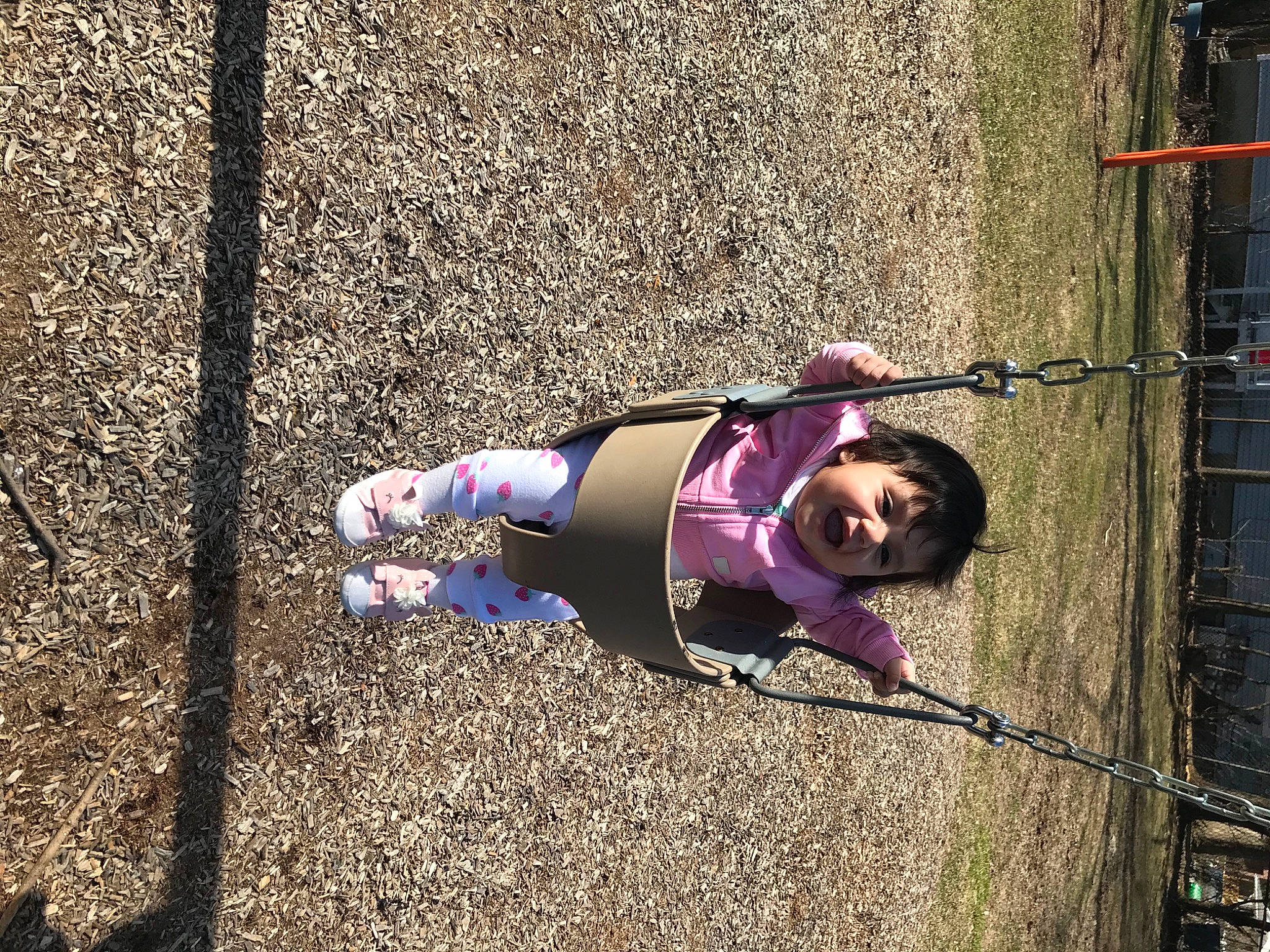 Camila is registered to the contest to win money with this photo: asphalt, child, city, electric_blue, fun, grass, human_leg, leg, leisure, magenta, pedestrian, person, purple, recreation, road_surface, shadow, sidewalk, soil, street_fashion, toddler