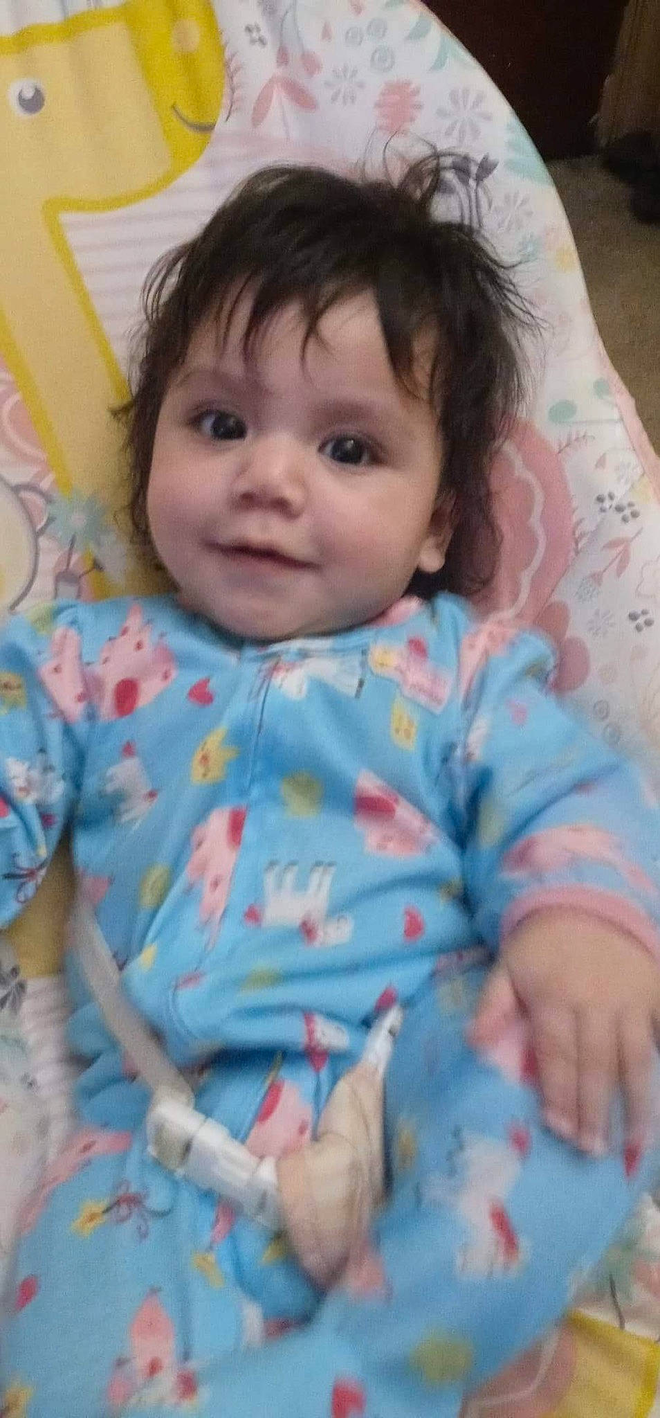 Camila is registered to the contest to win money with this photo: baby, baby_toddler_clothing, cheek, chin, clothing, eye, eyebrow, face, facial_expression, hair, head, iris, lip, mouth, nose, person, pink, skin, sleeve, smile