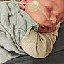 Walker is registered to the contest to win money with this photo: baby, sleeping, nasal_tube, hospital, medical_equipment, person, cuddling, closeup, infant, face, skin, clothing, bed, healthcare, newborn, patient, care, resting, child, treatment