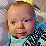 Tyson joined the competition — help win amazing prizes! baby, infant, face, smile, blue_clothing, blanket, giraffe_plush, pattern, closeup, child, cute, eyes, head, mouth, skin, young_child, indoors, soft_toy, portrait, happy