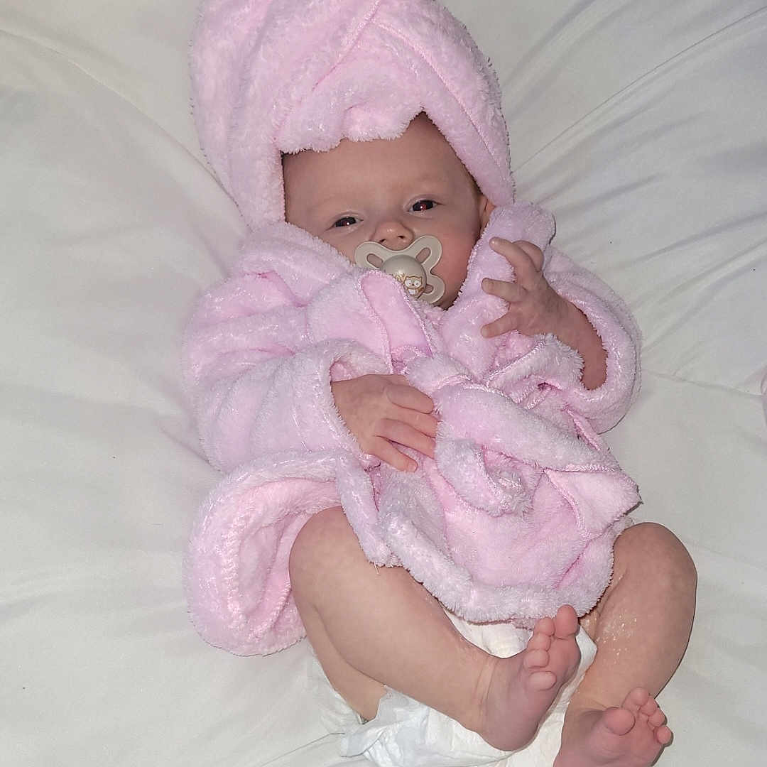 Sophia joined the competition — help win amazing prizes! baby, bed, blanket, bodypart, bonnet, clothing, face, finger, furniture, hand, hat, head, newborn, person, photography, portrait, quilt, sitting, sleeping, towel