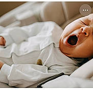 Damir participe au concours pour gagner de l'argent avec cette photo : baby, child, closeup, comfort, cozy, cushion, cute, face, hand, indoors, infant, mouth_open, newborn, relaxing, resting, skin, sleepy, soft, white_pajamas, yawning