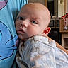 Kayson joined the competition — help win amazing prizes! baby, infant, child, portrait, face, eyes, wide_eyed, indoors, holding, cuddling, onesie, blanket, adult, shirt, home, kitchen, microwave, cardboard_box, mirror, photography