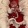 Haïley a rejoint le concours — aidez-le/la à gagner de superbes lots ! baby, infant, sleeping, red_bow, red_dress, white_blanket, pacifier, beaded_toy, booties, cozy, cute, festive, holiday, newborn, child, clothing, soft_texture, indoor, portrait, adorable