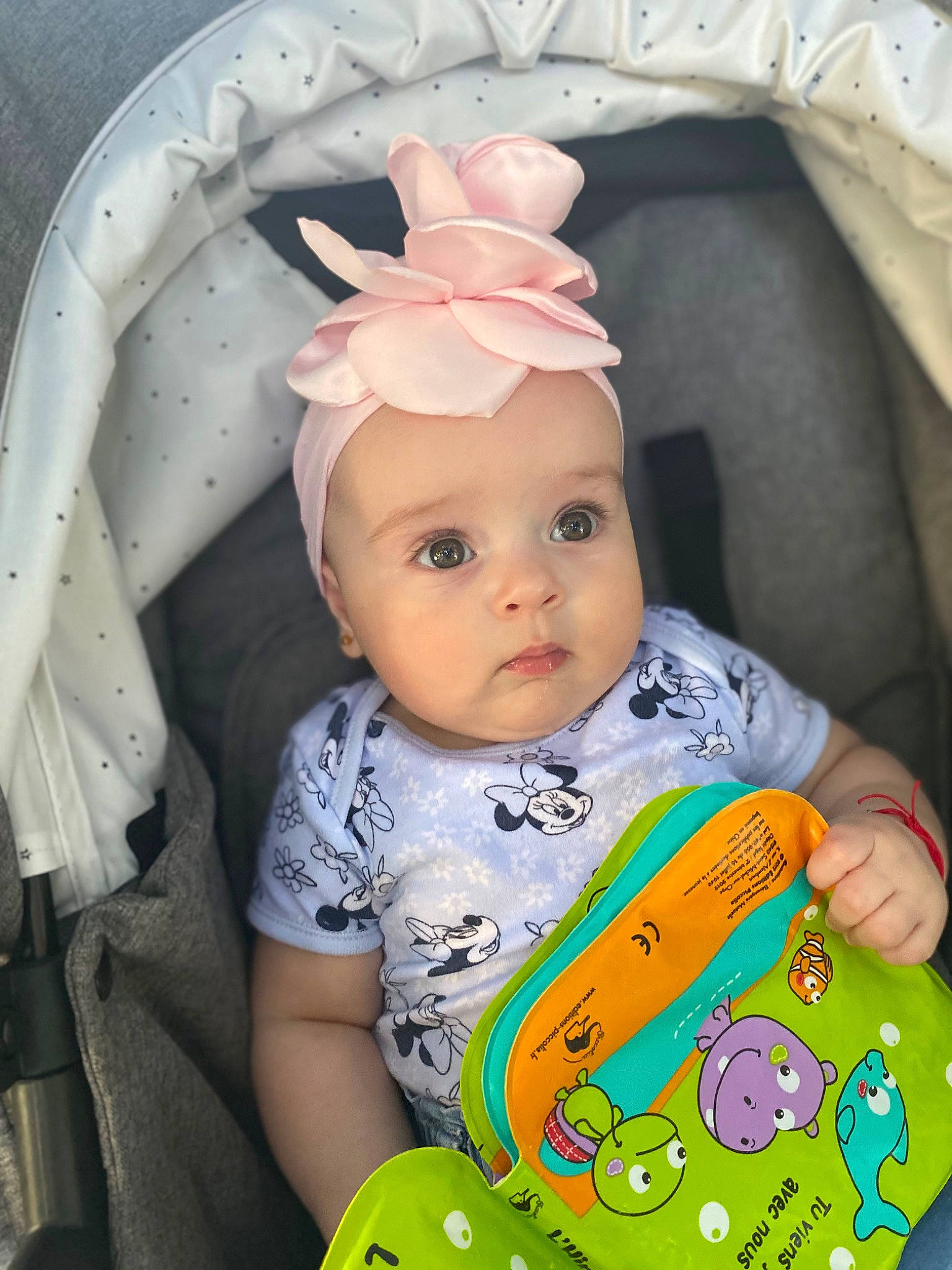Elisa is registered to the contest to win money with this photo: baby, baby_products, baby_toddler_clothing, beauty, cheek, child, doll, forehead, happy, head, headwear, iris, linens, nose, person, pink, product, skin, sleeve, textile