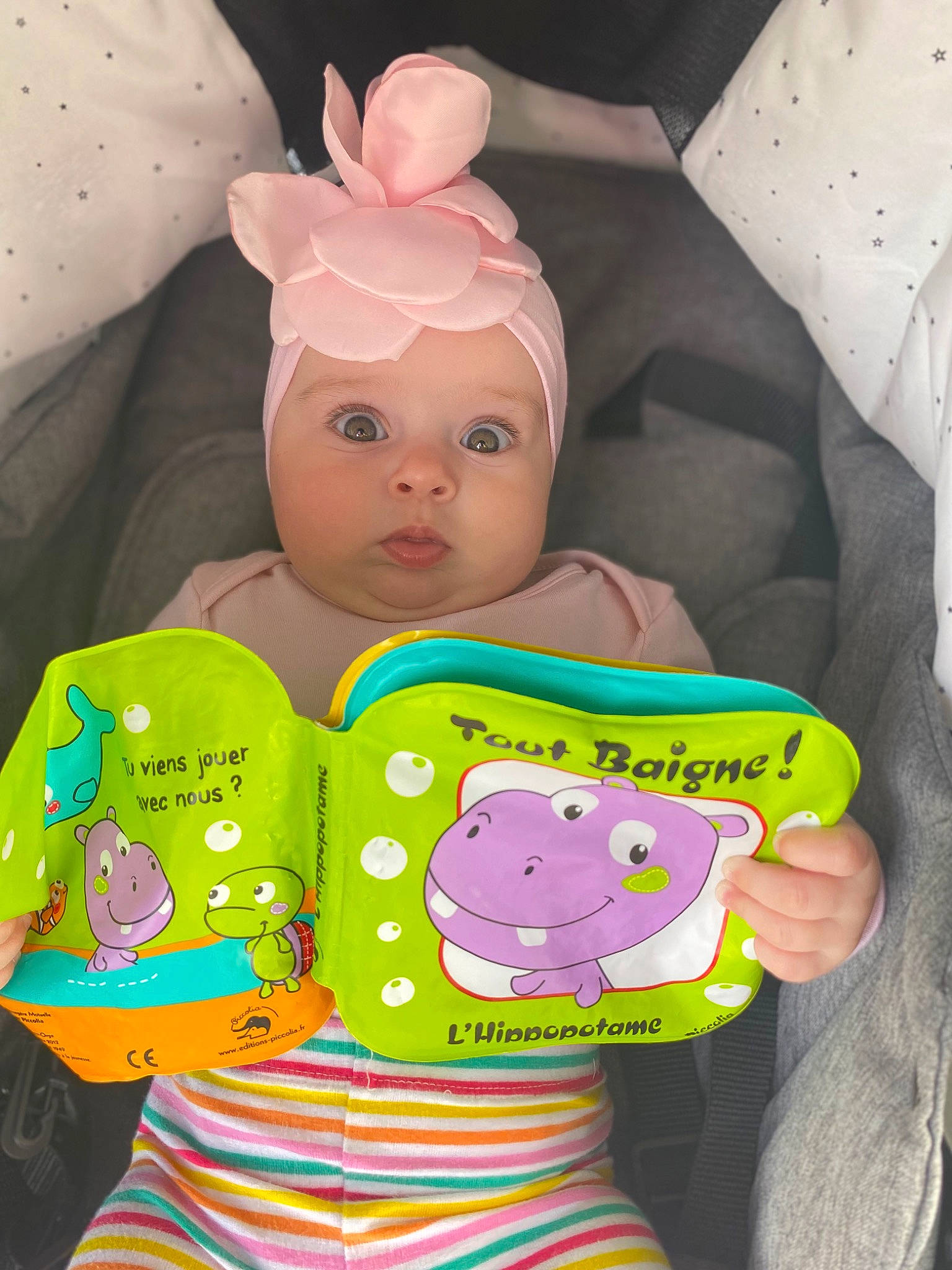 Elisa is registered to the contest to win money with this photo: baby, baby_products, baby_toddler_clothing, bedding, cheek, child, doll, happy, headwear, linens, magenta, nose, pattern, person, pink, product, room, skin, sleeve, textile