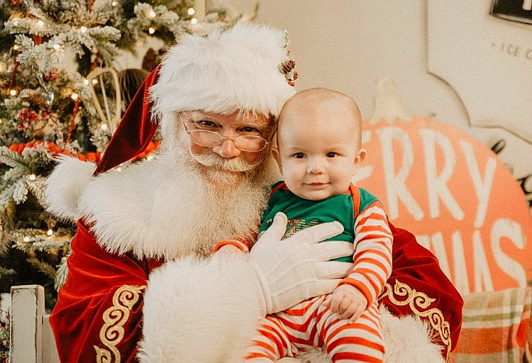 Anderson joined the competition — help win amazing prizes! baby, beard, child, christmas, christmas_eve, christmas_tree, comfort, event, facial_expression, fun, fur, happy, headwear, holiday, human_body, joy, person, picture_frame, santa_claus, smile