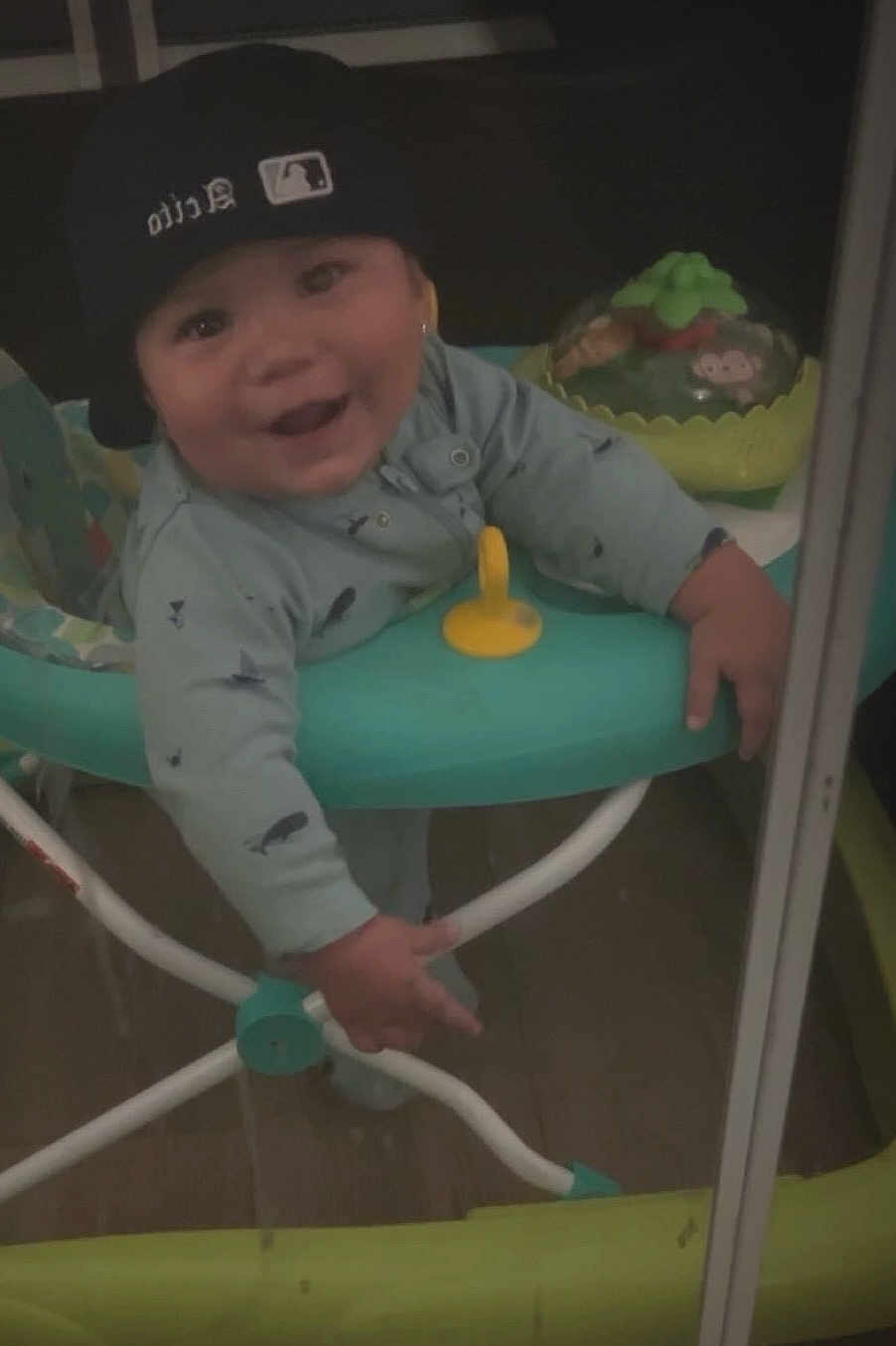 Acito is registered to the contest to win money with this photo: baby, child, smiling, indoor, baby_walker, cap, onesie, toy, happy, person, face, hand, floor, clothing, headwear, infant, play, joy, cute, young