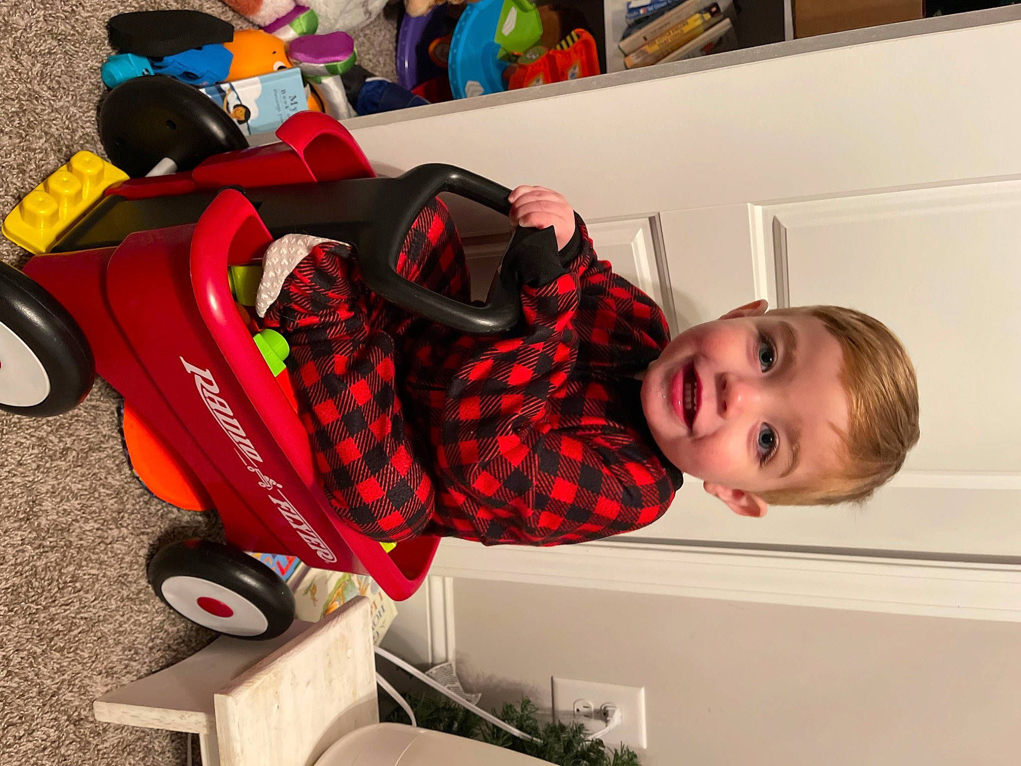Atlas is registered to the contest to win money with this photo: automotive_design, baby, baby_carriage, baby_products, baby_toys, carmine, child, fun, joy, motor_vehicle, pattern, person, plaid, plant, play, room, tire, toddler, toy, toy_vehicle