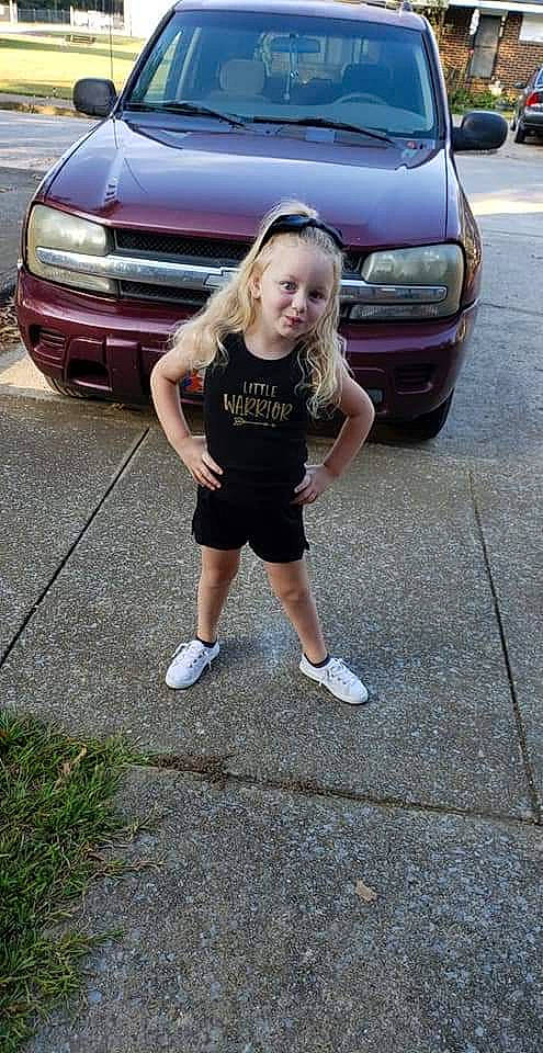 Karson is registered to the contest to win money with this photo: automotive_exterior, bumper, car, family_car, grille, hood, land_vehicle, minivan, person, subcompact_car, vehicle, vehicle_door