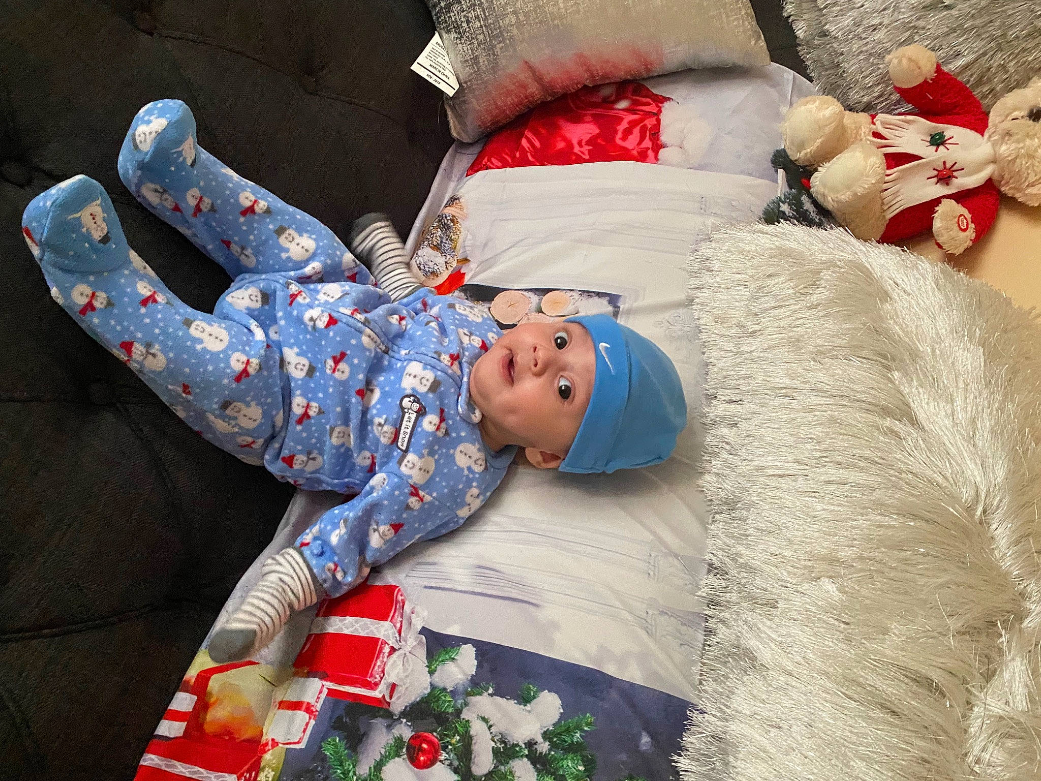 Karson joined the competition — help win amazing prizes! baby, baby_toddler_clothing, carmine, child, christmas, christmas_eve, comfort, event, flower_arranging, fur, happy, headwear, holiday, linens, pattern, person, red, room, sleeve, surprise