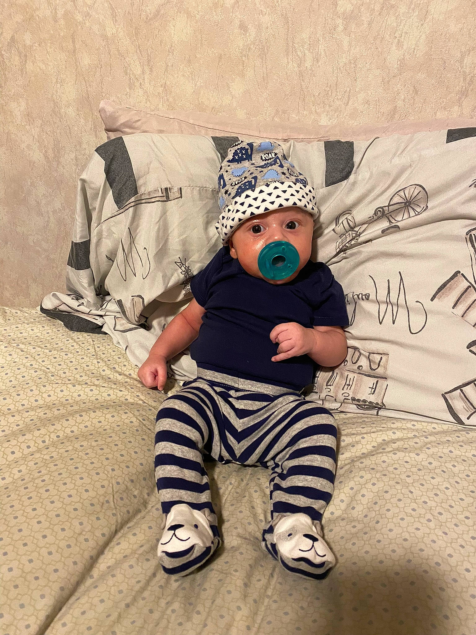 Karson is registered to the contest to win money with this photo: baby, baby_toddler_clothing, baseball_cap, cap, eyewear, fashion_accessory, flooring, font, fun, grass, happy, headwear, pattern, people_in_nature, person, personal_protective_equipment, play, sitting, sleeve, t_shirt