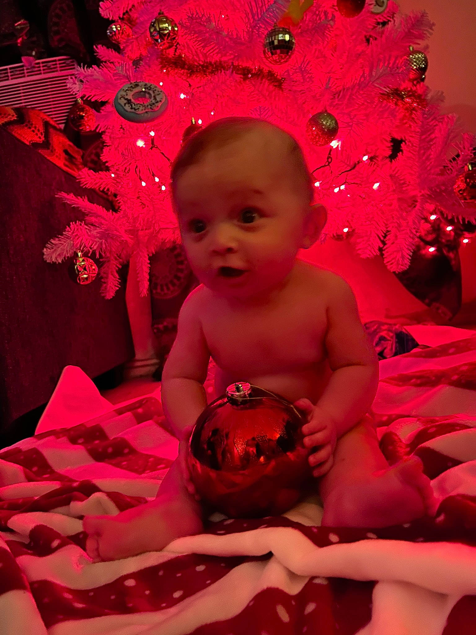 Graysen is registered to the contest to win money with this photo: art, baby, baby_toddler_clothing, carmine, child, event, flash_photography, fun, happy, holiday, human_leg, magenta, pattern, person, pink, purple, red, room, sitting, surprise