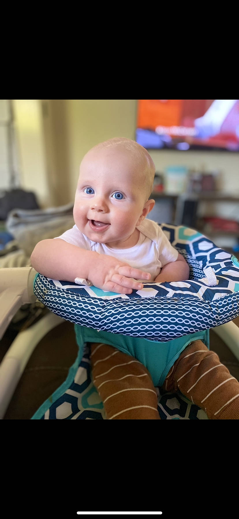 Levi is registered to the contest to win money with this photo: baby, baby_products, baby_safety, baby_toddler_clothing, chair, cheek, child, comfort, electric_blue, flash_photography, flooring, fun, happy, leisure, pattern, person, portrait_photography, room, sitting, smile