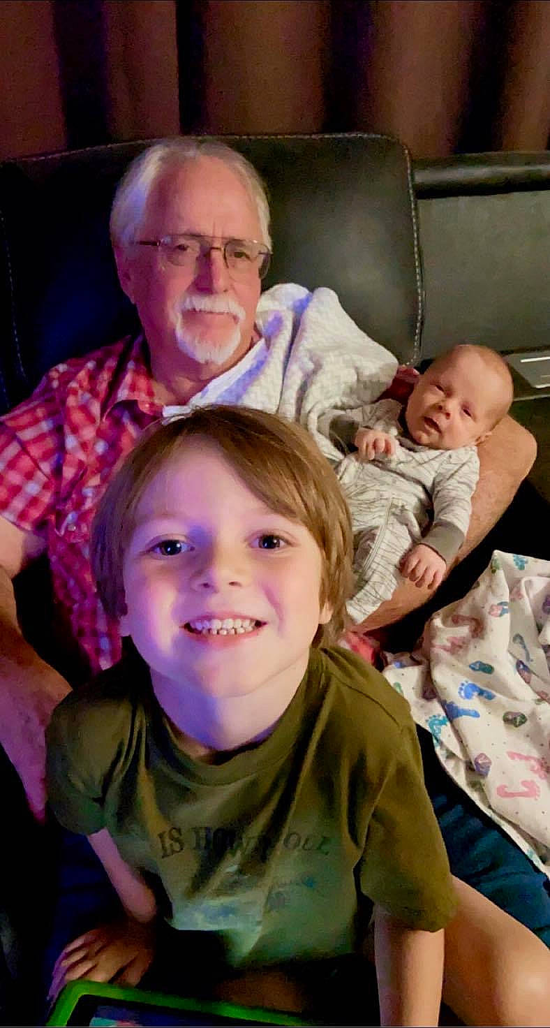 Liam is registered to the contest to win money with this photo: arm, cheek, chin, comfort, eye, face, facial_expression, finger, happy, head, interaction, iris, joy, mammal, mouth, muscle, nose, organ, person, skin