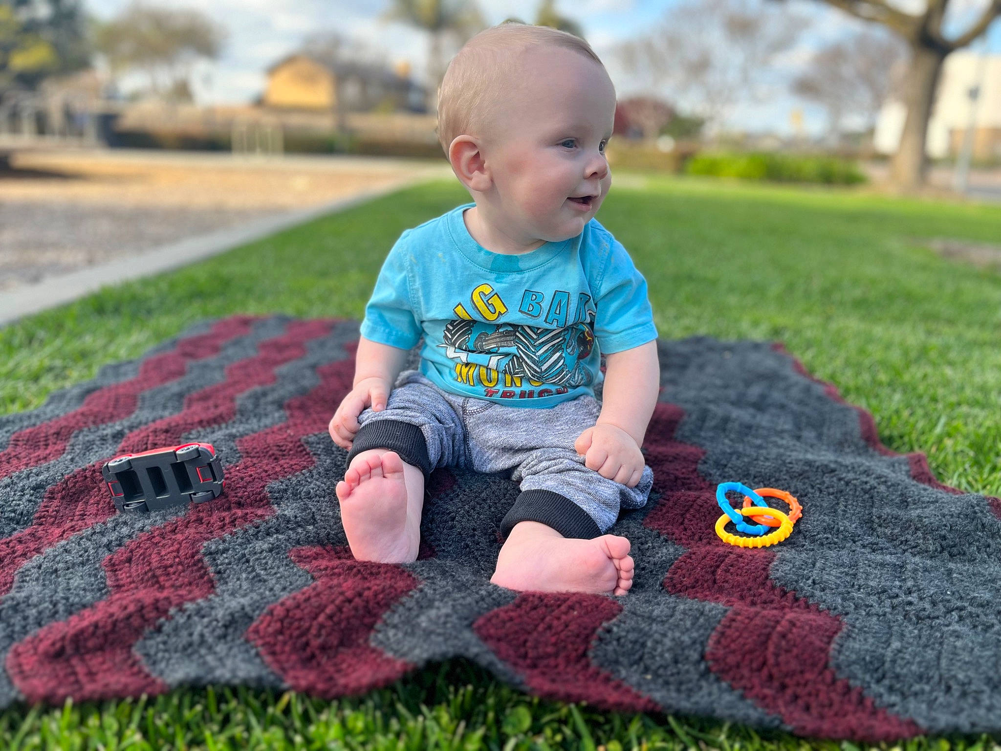 Joshua is registered to the contest to win money with this photo: baby, baby_toddler_clothing, child, fun, grass, grass_family, happy, lawn, leaf, leisure, mammal, people_in_nature, person, plaid, plant, red, sleeve, smile, t_shirt, tartan