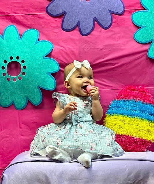 Temperance is registered to the contest to win money with this photo: art, beauty, blue, child, entertainment, event, fun, green, happy, headwear, leisure, magenta, party_supply, pattern, person, petal, photograph, pink, red, snapshot