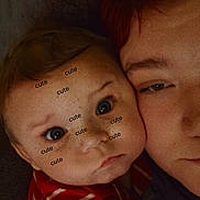 Malik joined the competition — help win amazing prizes! baby, child, adult, face, close_up, cuddle, red_striped_shirt, person, portrait, indoor, affection, skin, hair, expression, eyes, head, love, family, cozy, human