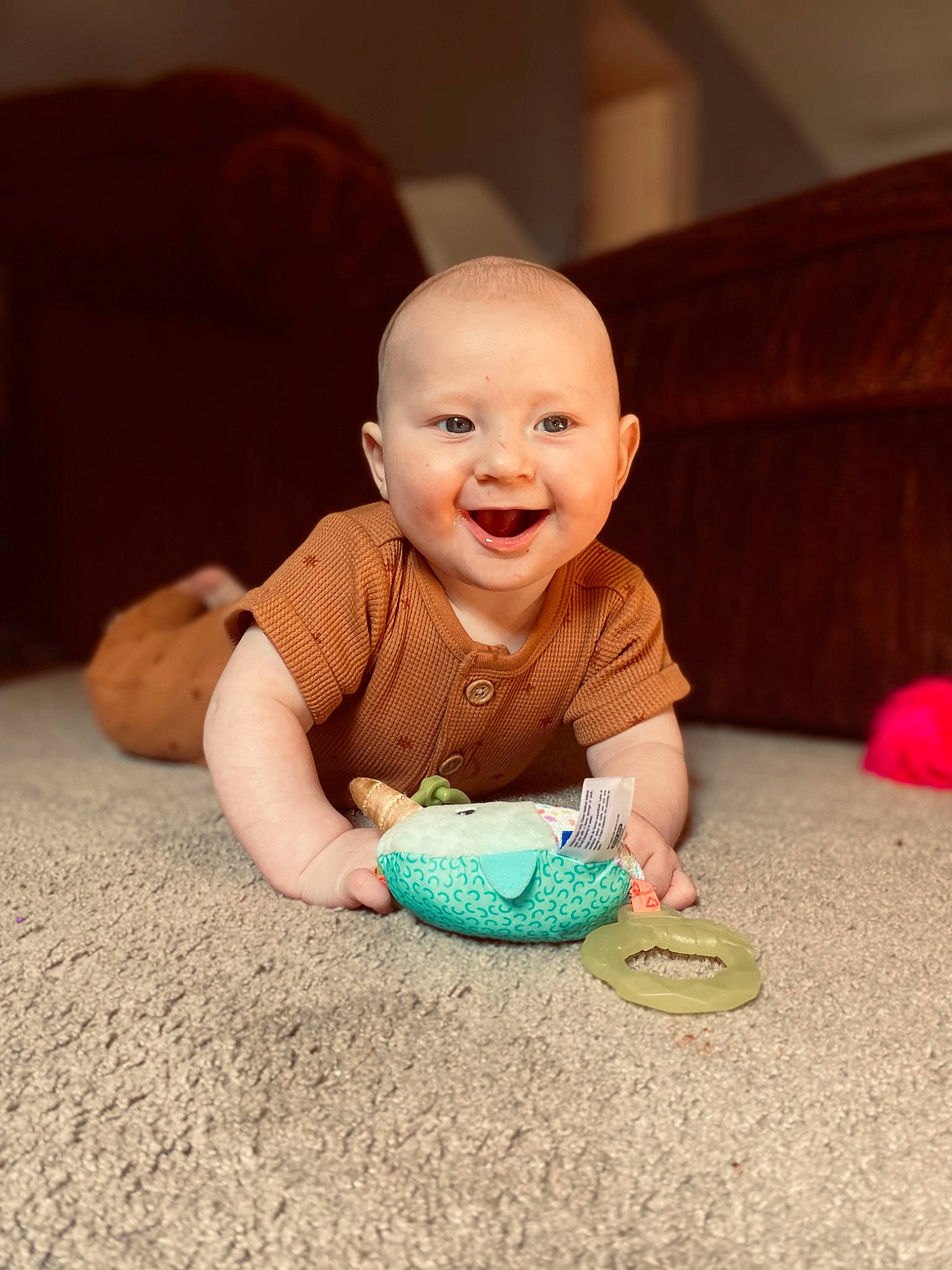 Axton is registered to the contest to win money with this photo: baby, baby_playing_with_toys, baby_toddler_clothing, cheek, chin, comfort, crawling, eye, finger, floor, flooring, fun, happy, joy, mouth, nose, person, skin, smile, toddler