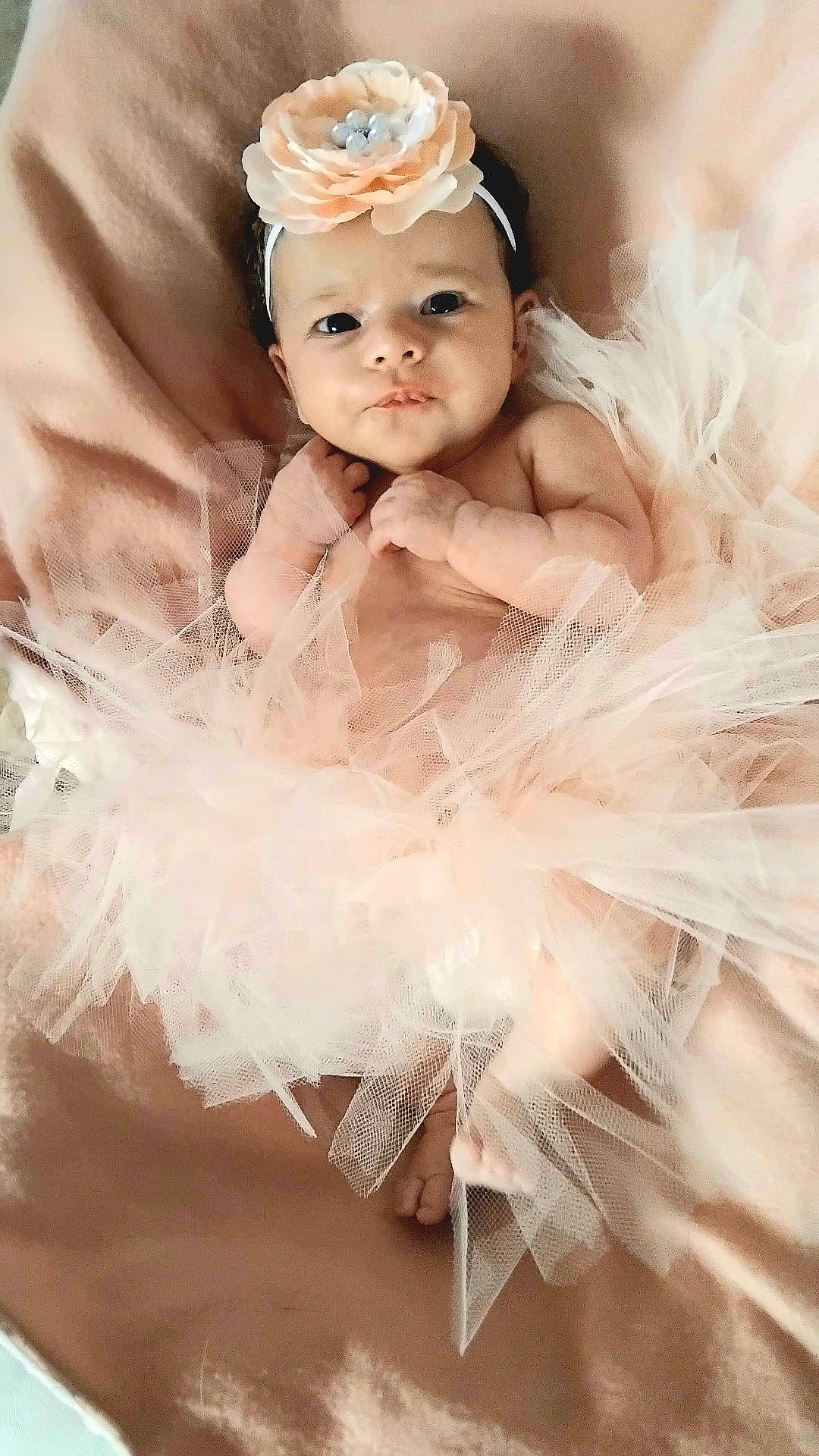 accessories, baby, bathing, clothing, costume, dress, face, flower, flowerarrangement, formalwear, happy, hat, head, jewelry, necklace, newborn, person, photography, portrait, smile