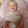 Oaklynn-Ayla joined the competition — help win amazing prizes! toddler, child, high_chair, bib, smile, food, messy, happy, indoor, pink, seat, baby, cute, person, young, mealtime, clothing, hands, face, feeding