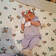 Oaklynn-Ayla joined the competition — help win amazing prizes! adult_face_partial, baby, baby_girl, bedroom, blanket, cozy, floral_pattern, headband, indoor, infant, mittens, mouth_open, newborn, pacifier, peaceful, portrait, purple_outfit, sleeping, socks, soft_texture