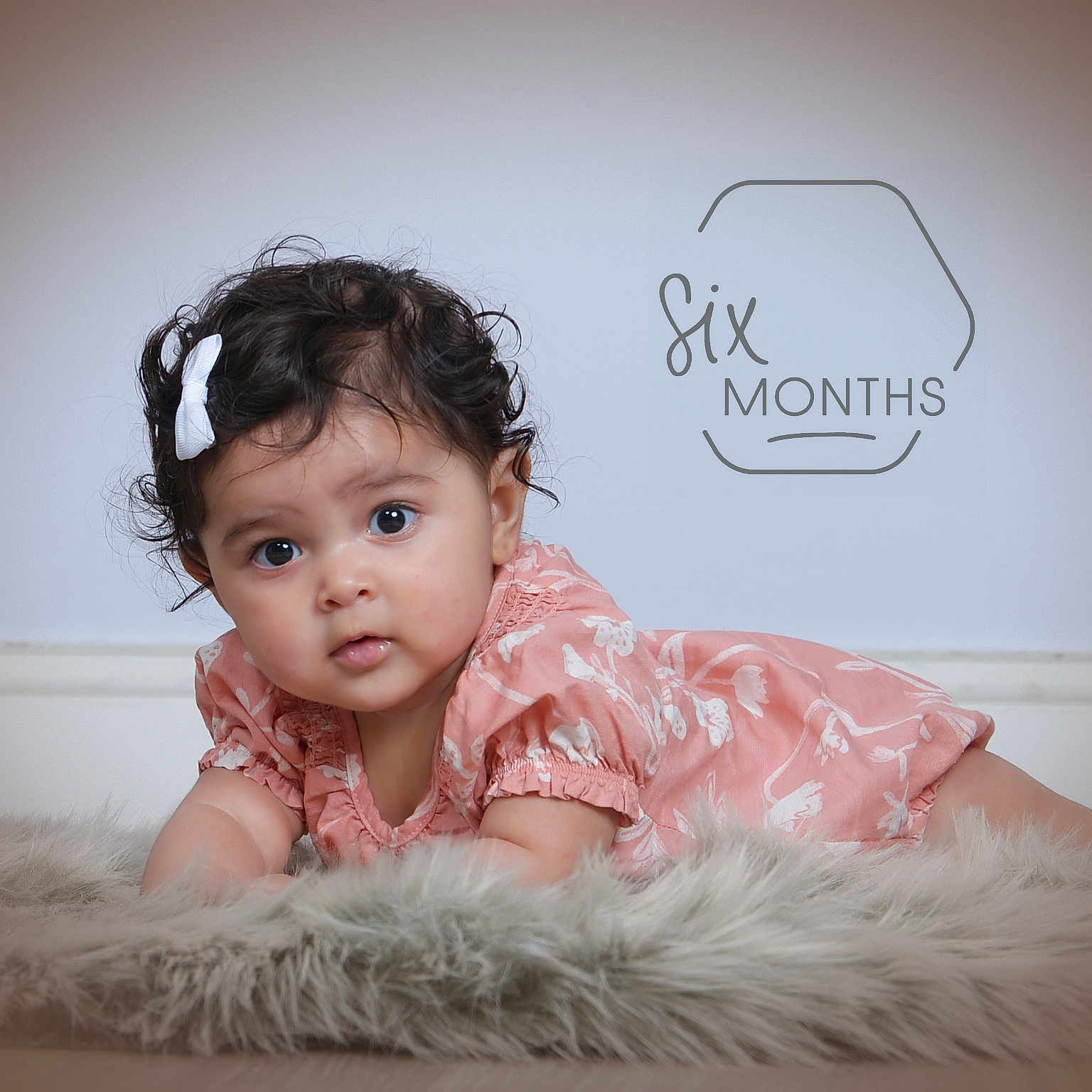 Zariah joined the competition — help win amazing prizes! baby, bodypart, clothing, couch, crawling, dress, face, finger, furniture, hand, happy, hardwood, head, newborn, person, photography, portrait, sitting, smile, wood