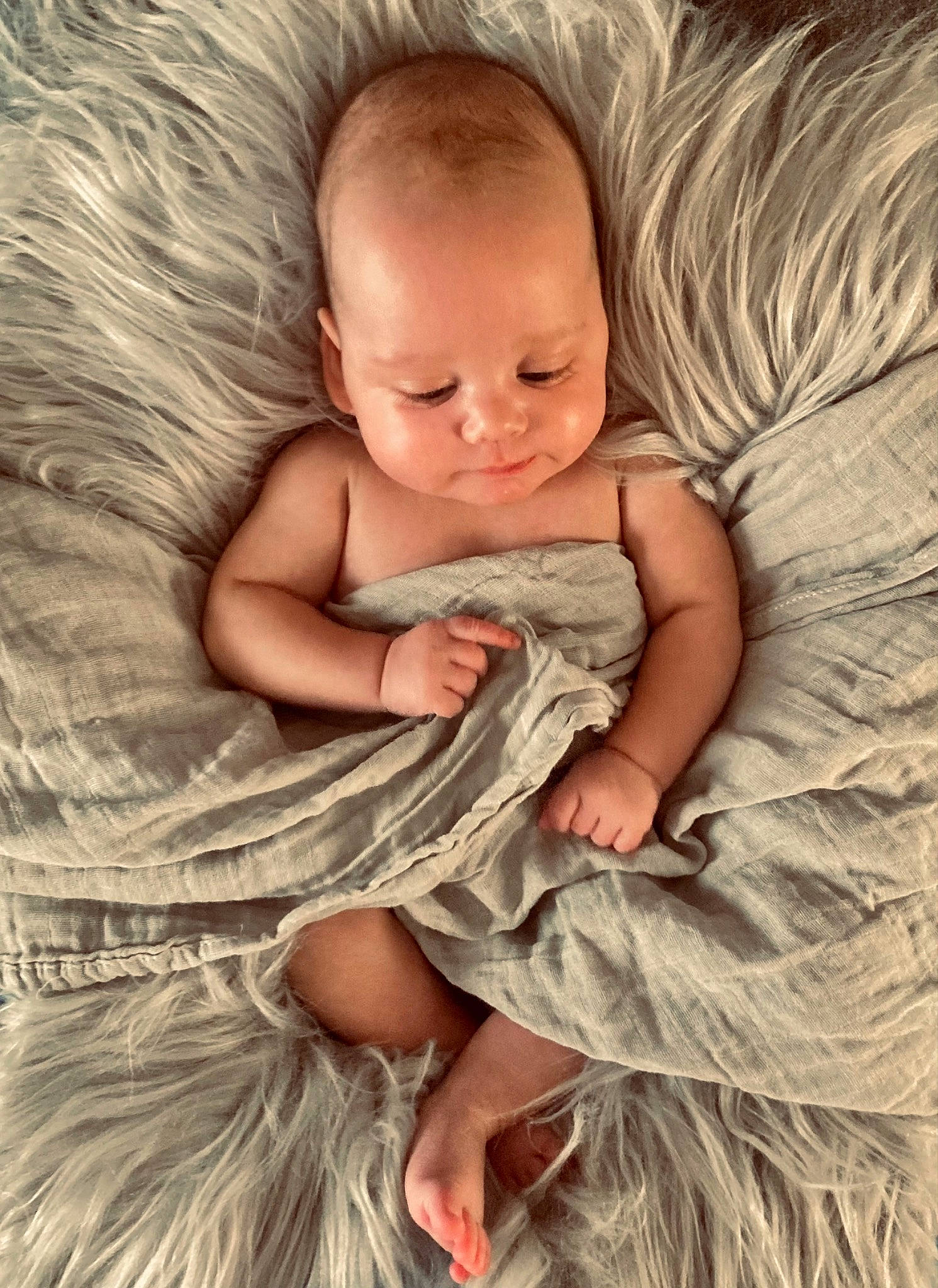Chandler joined the competition — help win amazing prizes! baby, baby_toddler_clothing, cheek, child, comfort, facial_expression, fur, gesture, grass, happy, iris, linens, mammal, pattern, person, sitting, skin, sleeve, textile, toddler