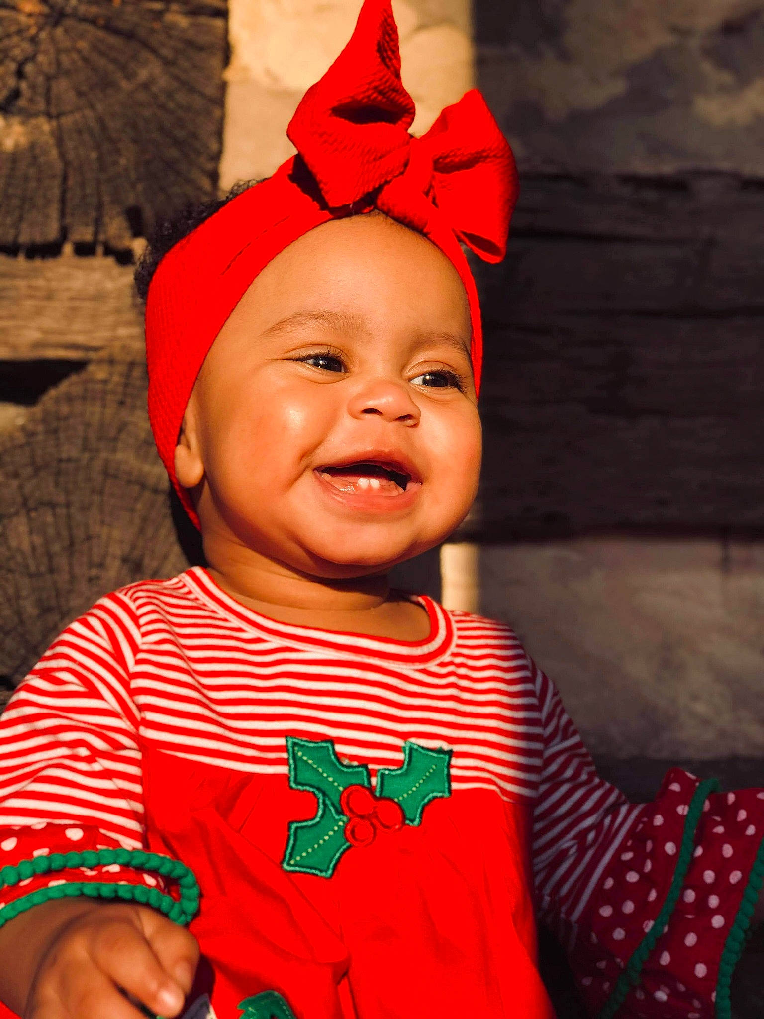 Arayah is registered to the contest to win money with this photo: baby, baby_toddler_clothing, bracelet, carmine, costume, costume_accessory, costume_hat, ear, happy, headgear, headwear, laugh, lip, nail, party_supply, person, pleased, red, toddler