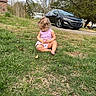 River joined the competition — help win amazing prizes! toddler, child, grass, outdoor, car, black_car, trees, barefoot, purple_tank_top, curly_hair, nature, road, daytime, park, casual_clothing, curious, sitting, greenery, young_child, relaxation