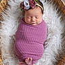 newborn, baby, sleeping, wrapped, purple_blanket, floral_headband, basket, woven_basket, white_fur, soft_texture, cozy, peaceful, infant, cute, portrait, indoors, feet, head, face, sleep