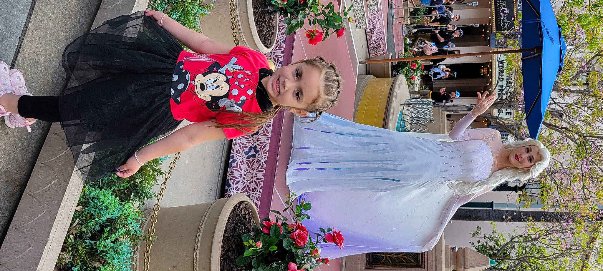 Izabella is registered to the contest to win money with this photo: community, dress, event, fashion_design, flower, flowerpot, fun, green, happy, houseplant, joy, leisure, magenta, person, photograph, pink, plant, smile, social_group, summer