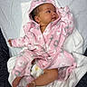 baby, infant, pink_robe, blanket, diaper, foot, hand, face, cute, sleepwear, soft_texture, laying_down, newborn, child, hooded_clothing, cozy, resting, skin, indoors, comfort