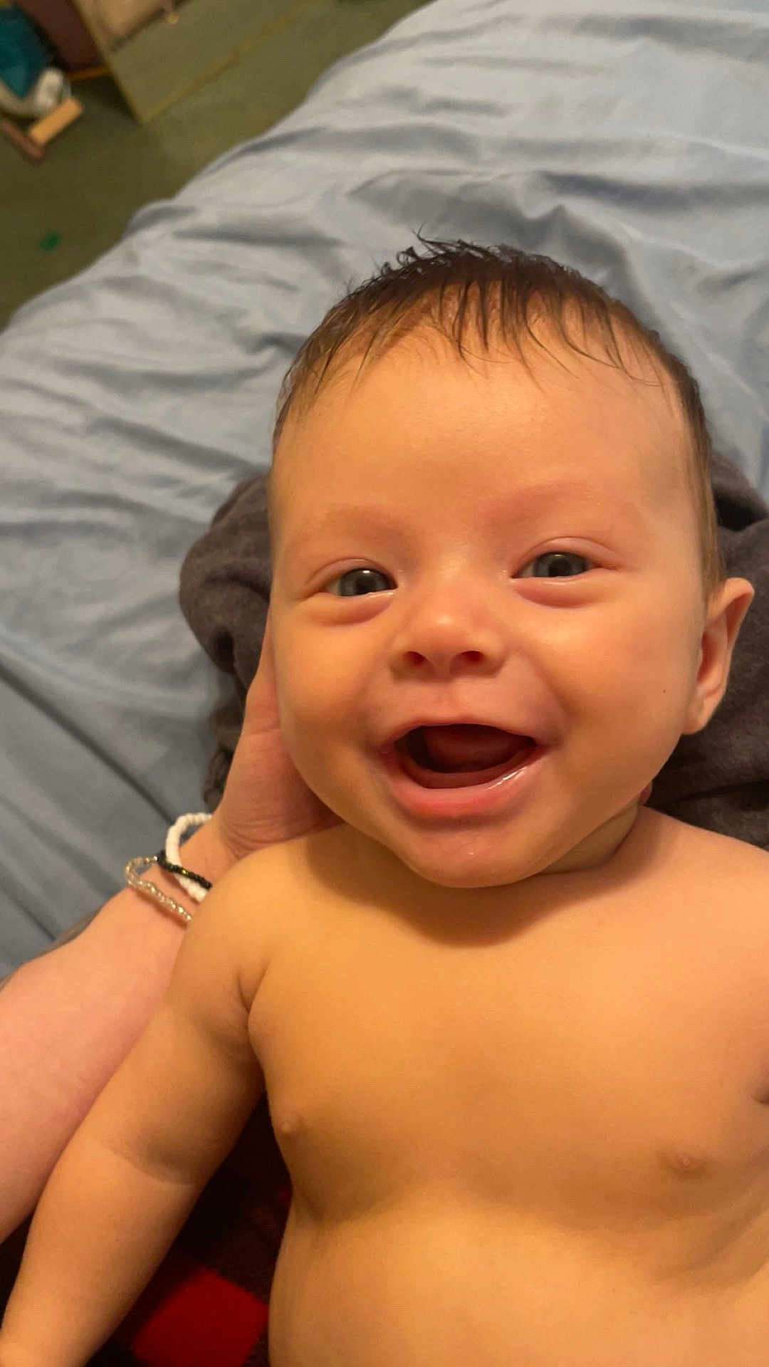 Phoenix is registered to the contest to win money with this photo: baby, smiling, face, child, skin, human, person, happy, infant, portrait, cute, expression, head, hand, blanket, indoors, young, closeup, naked_torso, baby_skin