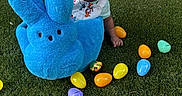 Zyaire joined the competition — help win amazing prizes! baby, child, hat, plush_toy, blue_bunny, easter_eggs, grass, outdoor, smiling, happy, colorful, toy, playtime, cute, infant, person, spring, holiday, fun, background