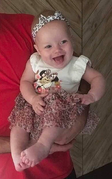 Marlie is registered to the contest to win money with this photo: baby, child, dress, hair_accessory, head, headgear, headpiece, joy, person, pink, smile, toddler