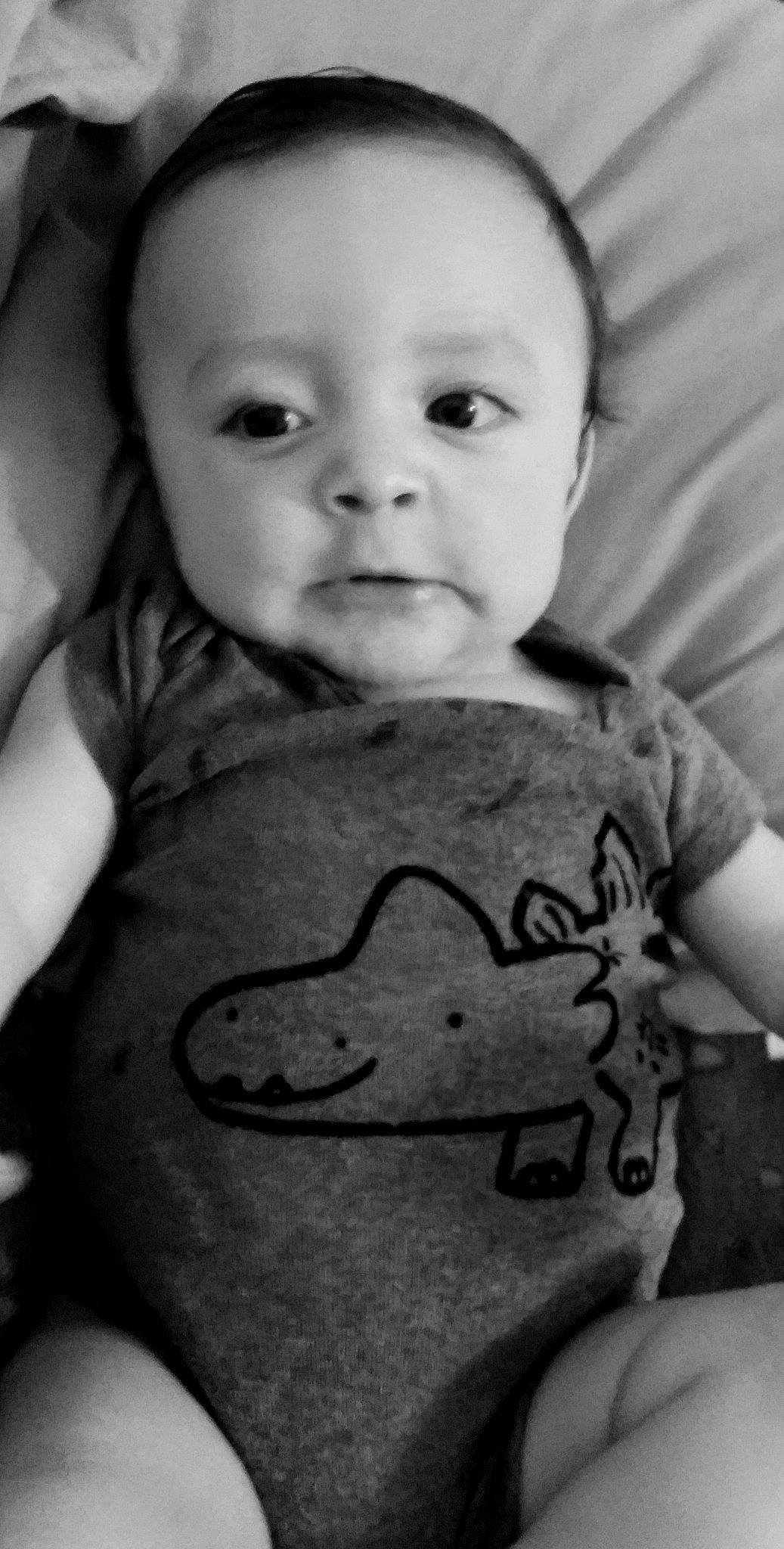 Mike is registered to the contest to win money with this photo: arm, baby, black, black_and_white, cheek, child, chin, eye, face, facial_expression, forehead, head, lip, monochrome, mouth, nose, person, skin, smile, toddler